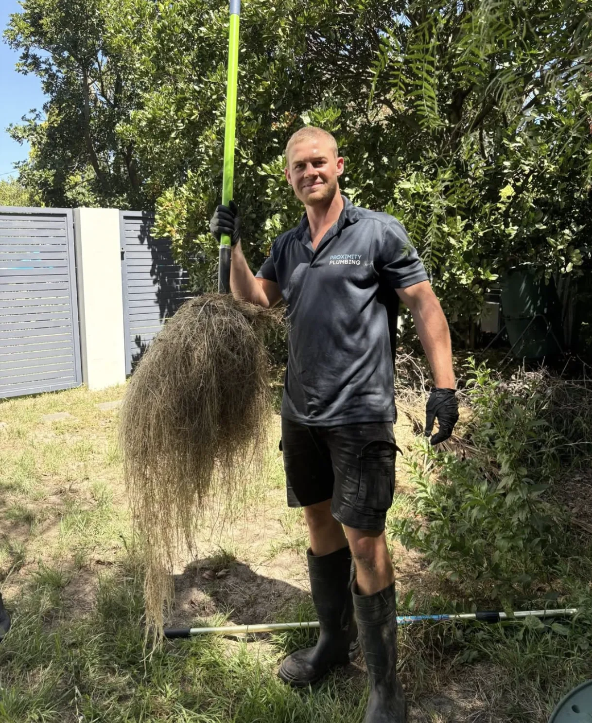 A mass of tree roots pulled out of a blocked drain